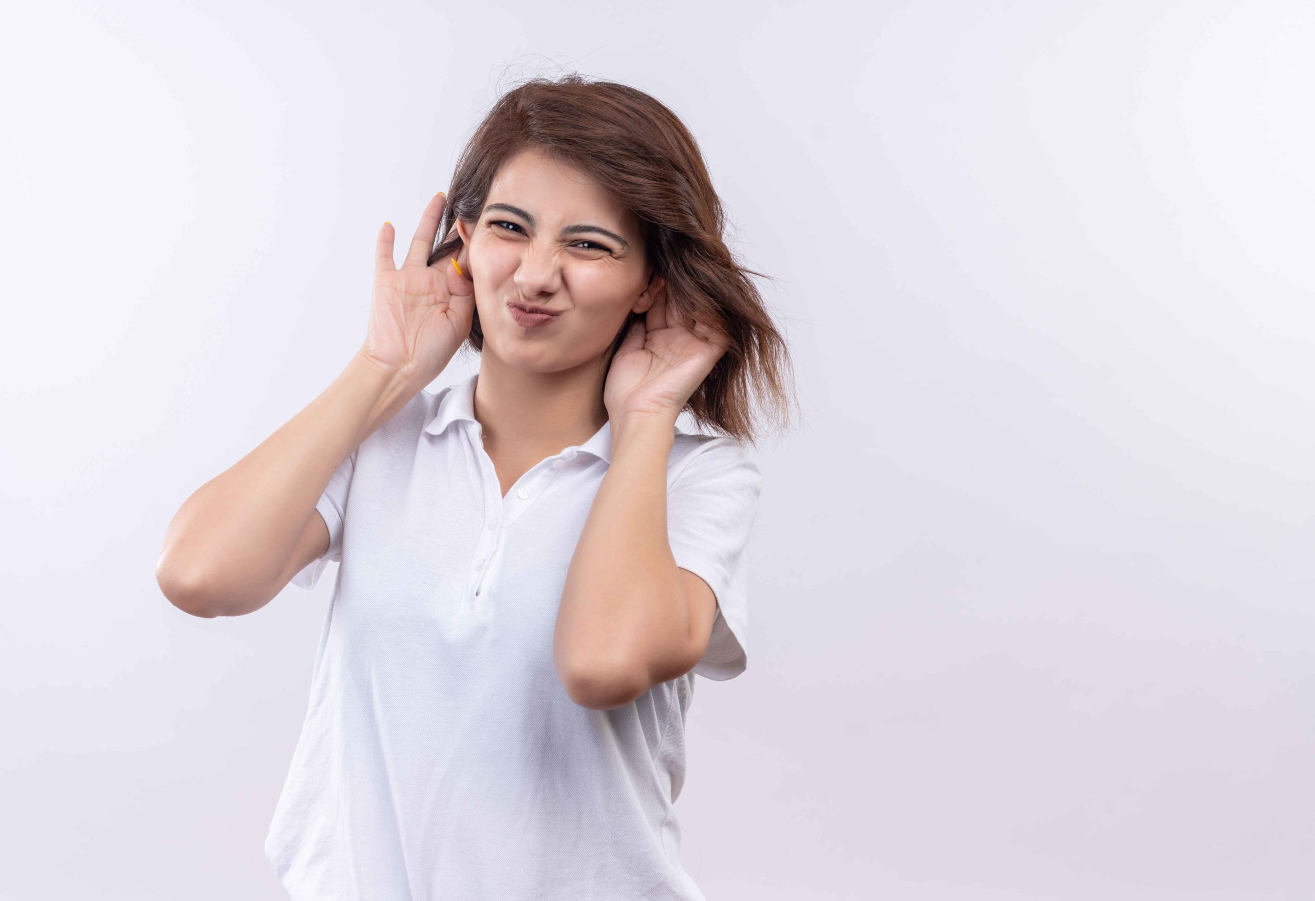 young-girl-with-short-hair-wearing-white-polo-shirt-making-grimace-imitating-big-ears-with-hands (1) Hearing issues